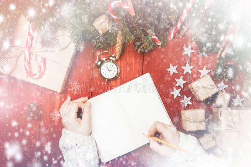 Christmas composition New Year woman writes something in blank n royalty free stock images Christmas composition New Year woman writes something in blank n royalty free stock images