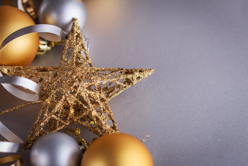 Christmas composition of Christmas tree toys on a blurred silver background