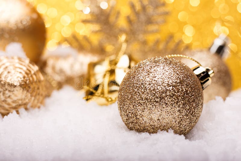 Christmas composition of Christmas tree toys on a gold background
