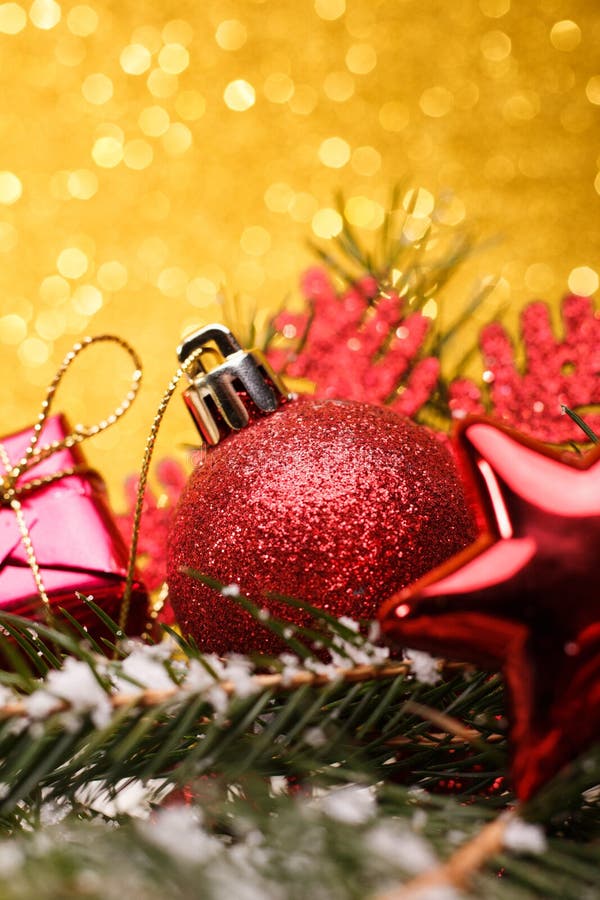 Christmas composition of Christmas tree toys on a gold background