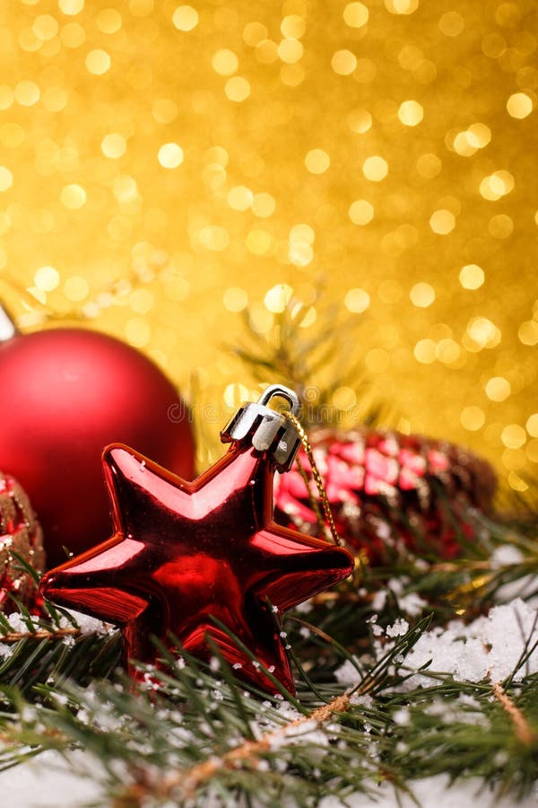 Christmas composition of Christmas tree toys on a gold background