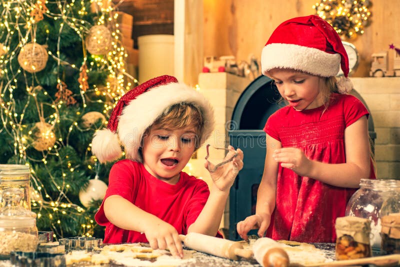 Christmas cookery. Children cooking for christmas. Thanksgiving day and Christmas for children. Children are cooking