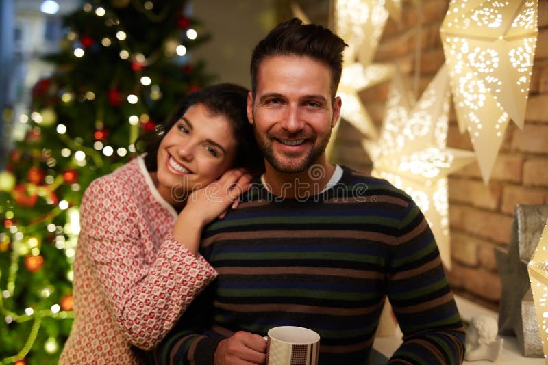 Christmas couple at home in Winter stock photography