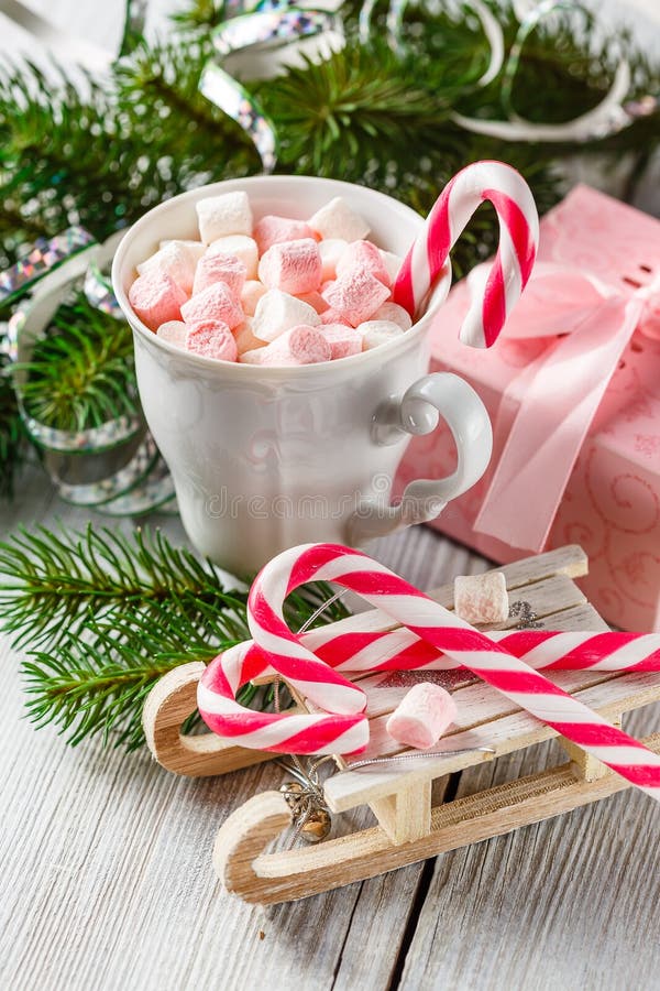 Christmas cup with small marshmallows and candy canes