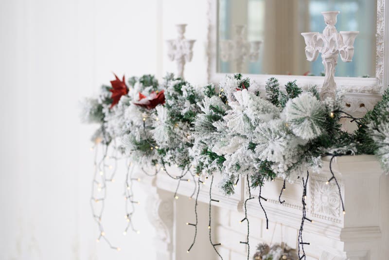 Christmas decor on a white fireplace. White background. royalty free stock photography