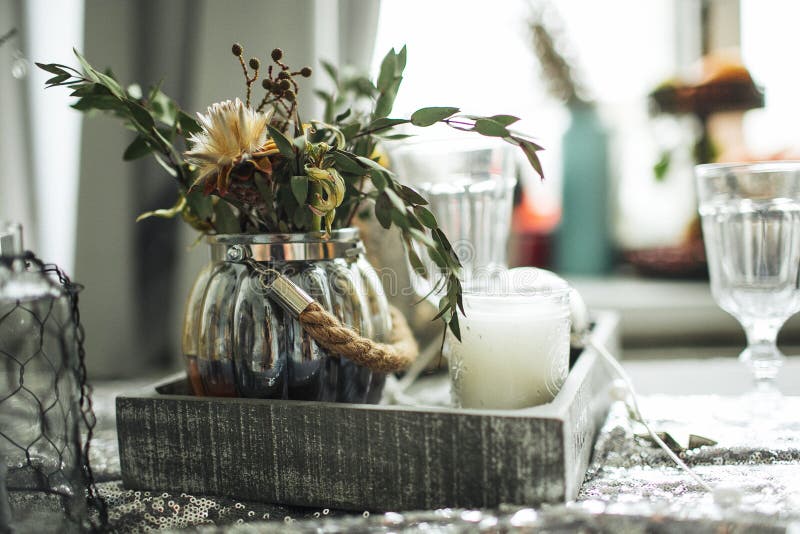 Christmas decorated table candles in the room stock images