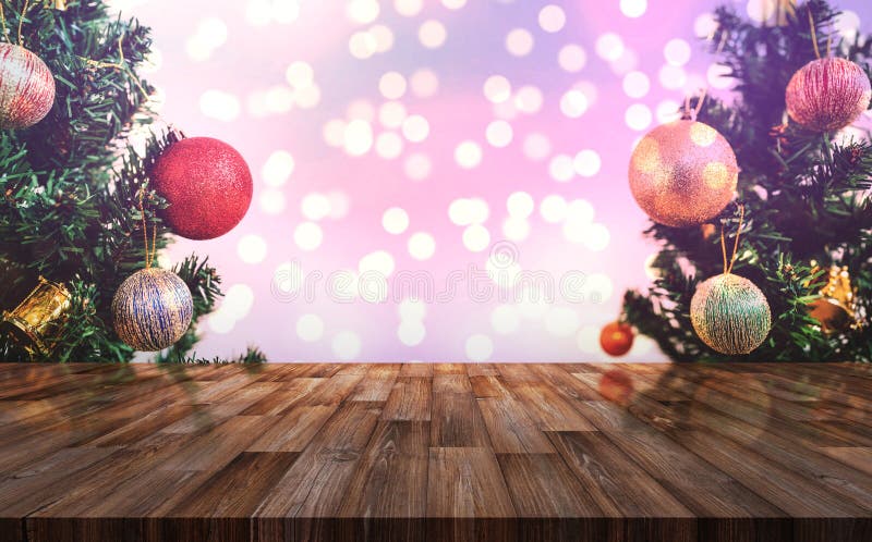 Christmas decoration background. Wooden desk with Christmas tree and Colorful Bokeh lights backgrounds