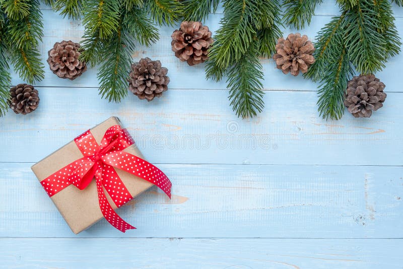 Christmas decoration, gift box and pine tree branches on wooden background, preparation for holiday concept, Happy New Year and Xm