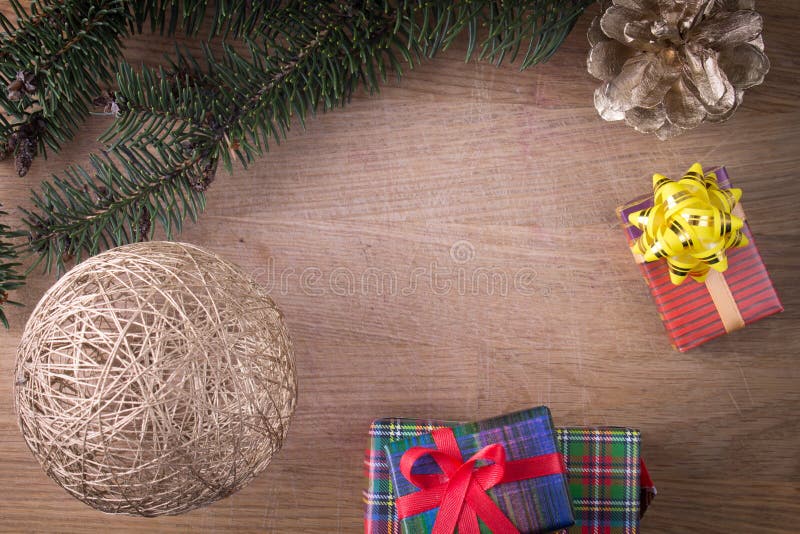 Christmas decoration with gifts on old wood