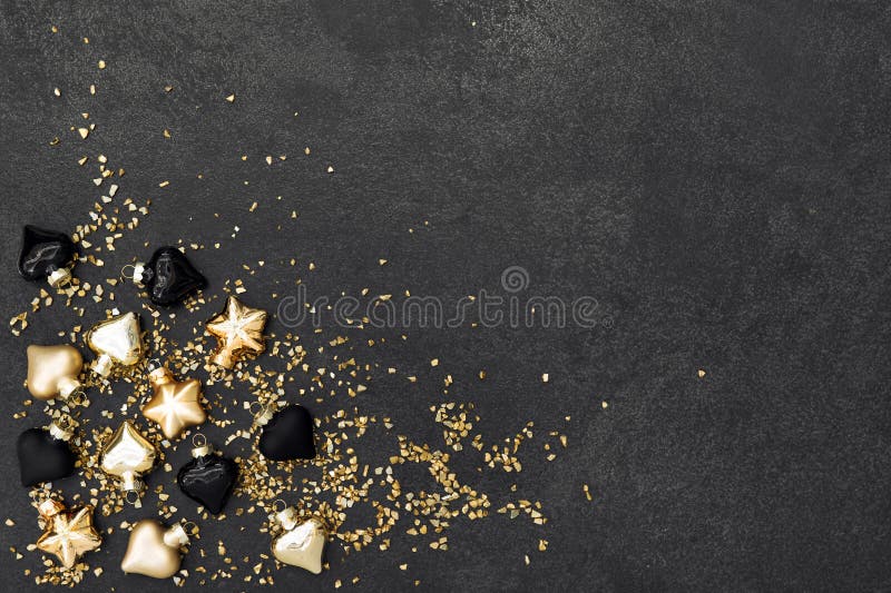 Christmas decoration golden black ornaments dark background
