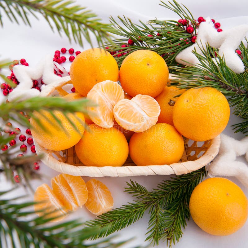 Christmas decoration with mandarins and fir tree