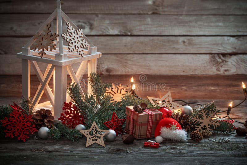 Christmas decoration with white lantern on wooden background