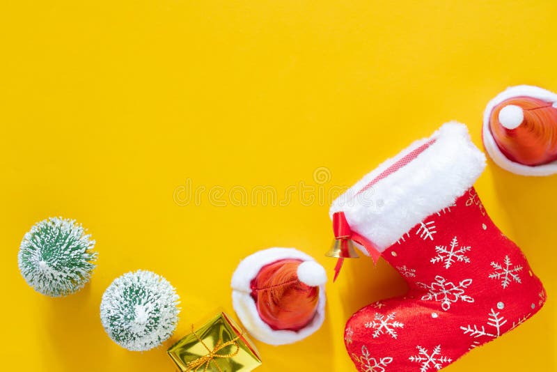 Christmas decorations, Christmas, winter, new year concept. Christmas present red gifts box and decorating elements on yellow stock photo