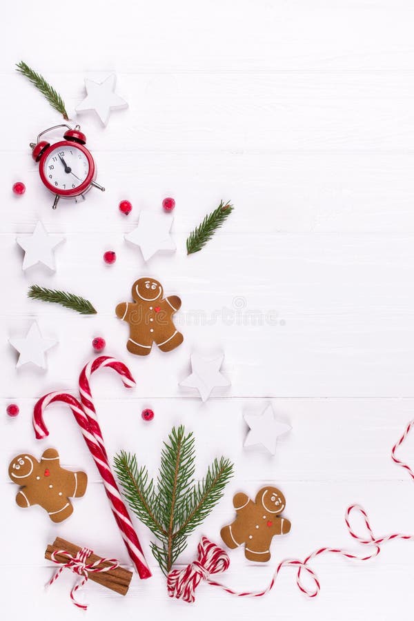 Christmas Decorative Border made of Festive Elements. Smiling gingerbread man, christmas white decorations, pine branches. royalty free stock images Christmas Decorative Border made of Festive Elements. Smiling gingerbread man, christmas white decorations, pine branches. royalty free stock images