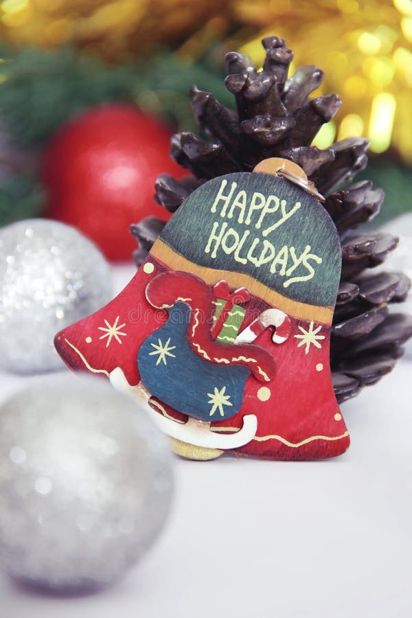 Christmas decorative multicolored bell on a New Year background royalty free stock photography
