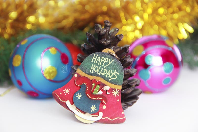 Christmas decorative multicolored bell on a New Year background stock photography