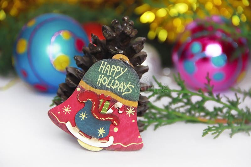 Christmas decorative multicolored bell on a New Year background stock image