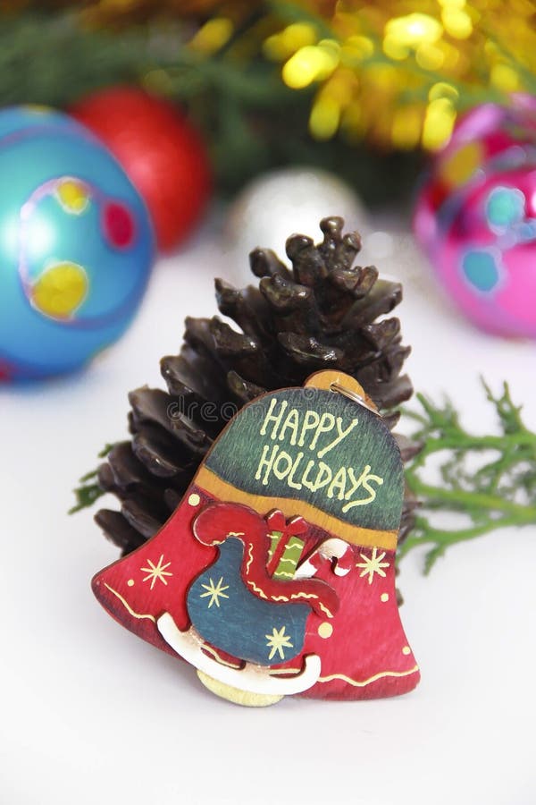 Christmas decorative multicolored bell on a New Year background stock photography