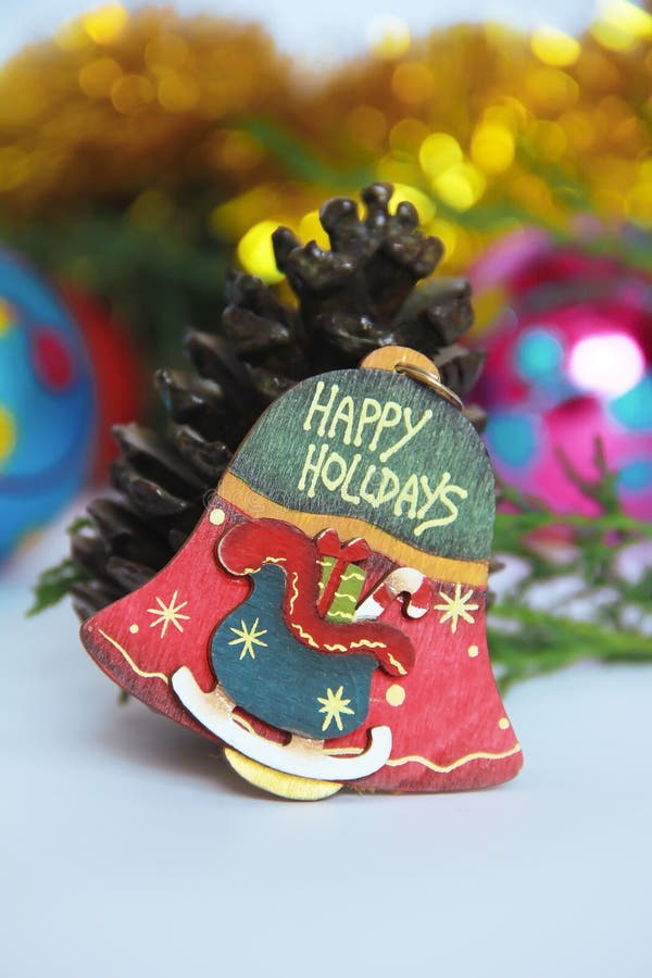 Christmas decorative multicolored bell on a New Year background stock image