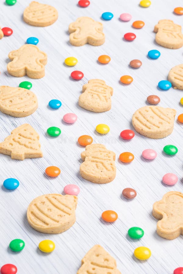 Christmas Different Shaped Cookies and Multicolored Sweets on a Light