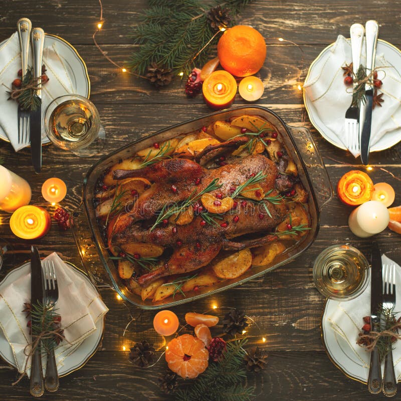 Christmas dinner with duck and fruit, festive table setting, New Year. Flat-lay