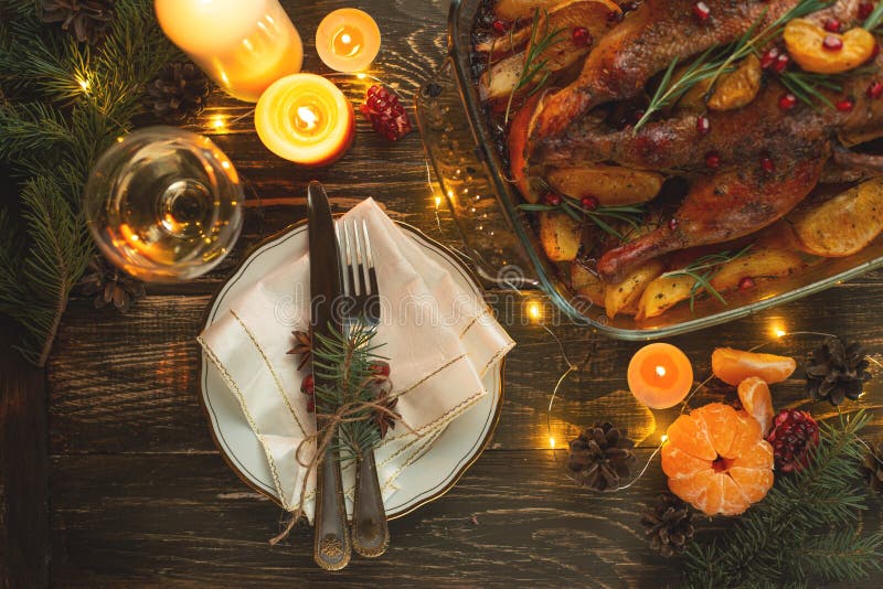 Festive dinner with candles, New Year`s or Christmas table