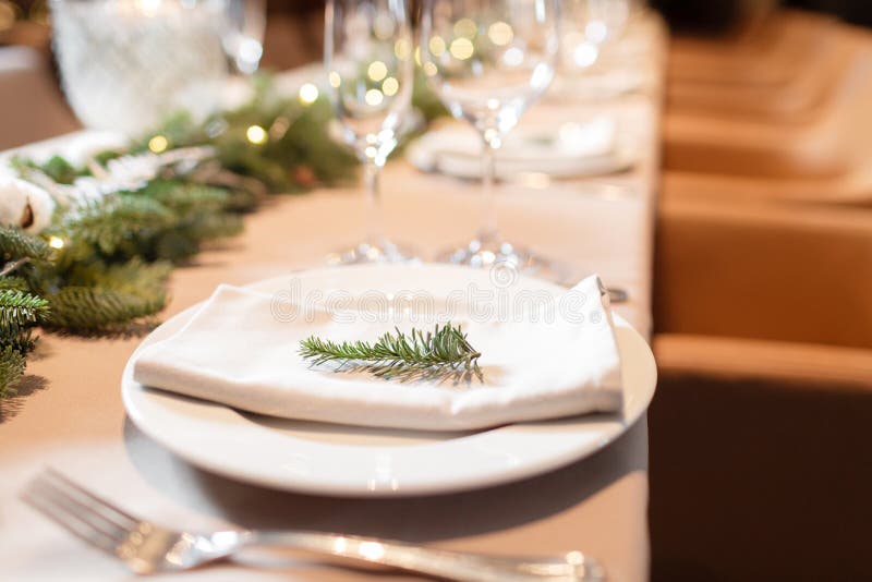 Christmas dinner feast. A decorated dining table with champagne glasses and christmas tree in background royalty free stock images Christmas dinner feast. A decorated dining table with champagne glasses and christmas tree in background royalty free stock images