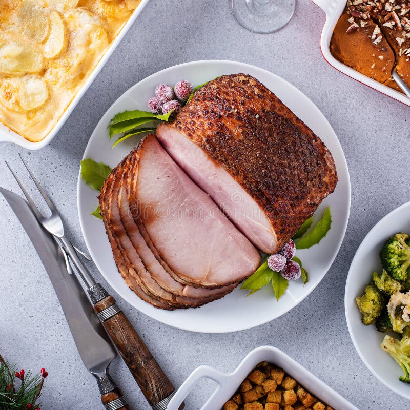 Christmas Dinner with Honey Spiral Sliced Ham and Side Dishes Stock