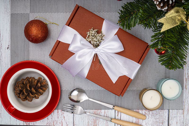 Christmas Dinner Table Decorations with Red Gift Boxes and Scented