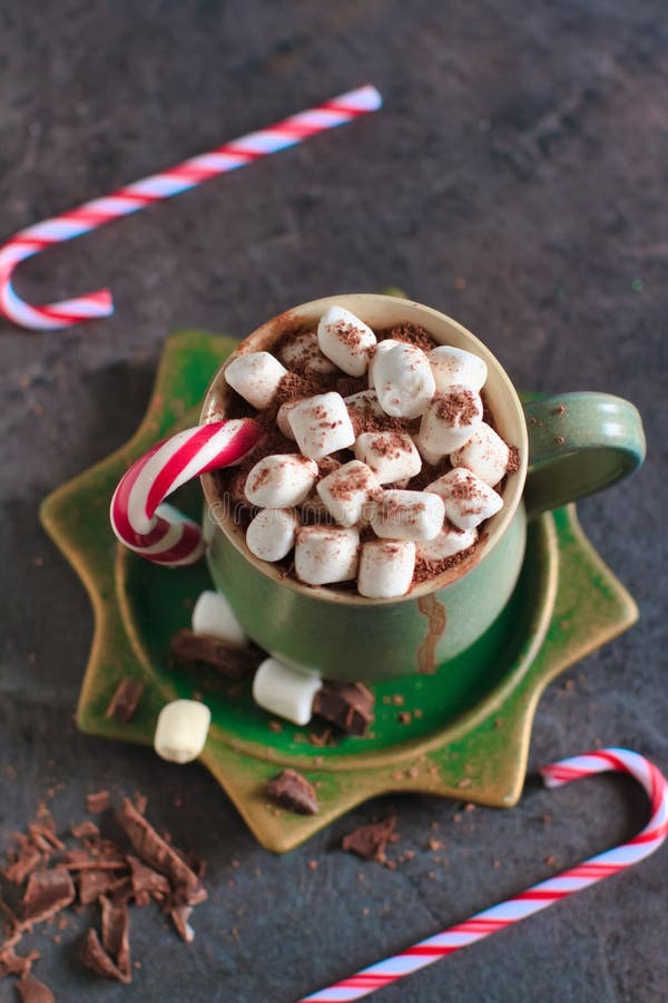 Christmas drink with decorations. Winter warming sweet drink hot chocolate with marshmallows and cocoa in mug and Christmas decorations stock image Christmas drink with decorations. Winter warming sweet drink hot chocolate with marshmallows and cocoa in mug and Christmas decorations stock image