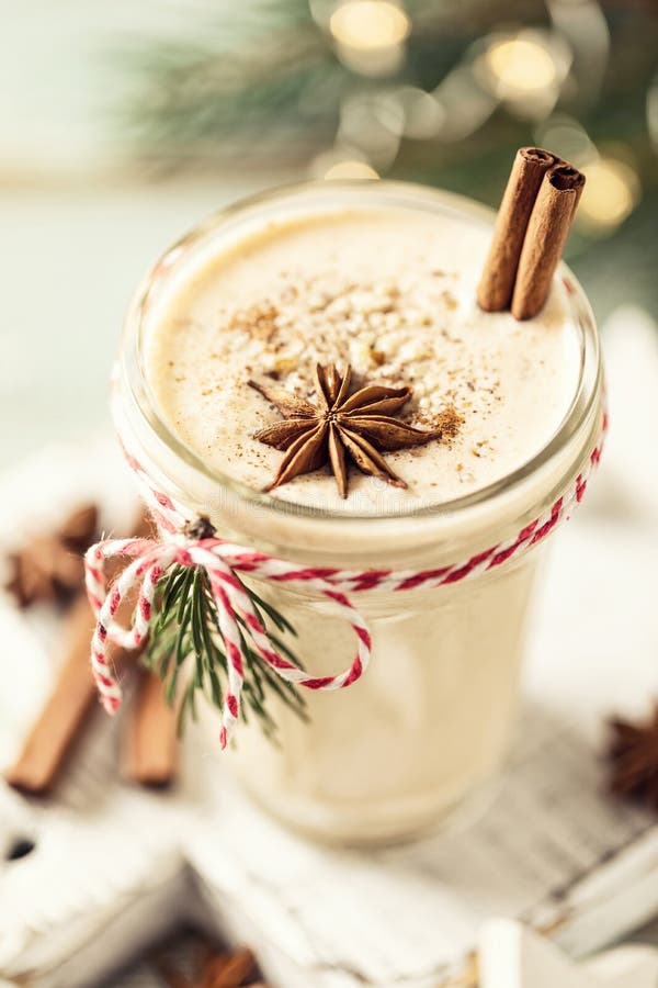 Eggnog. Traditional Christmas drink, spiced egg-milk cocktail with nut topping. Eggnog. Traditional Christmas drink, spiced egg-milk cocktail with nut topping