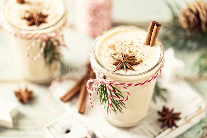 Eggnog. Traditional Christmas drink, spiced egg-milk cocktail with nut topping. Eggnog. Traditional Christmas drink, spiced egg-milk cocktail with nut topping