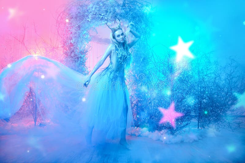 Fabulous forest nymph in a magical winter forest. Fairy world. Christmas winter`s tale. Fabulous forest nymph in a magical winter forest. Fairy world. Christmas winter`s tale