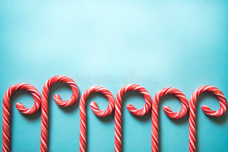 Christmas festive candy canes on pastel background royalty free stock photos Christmas festive candy canes on pastel background royalty free stock photos
