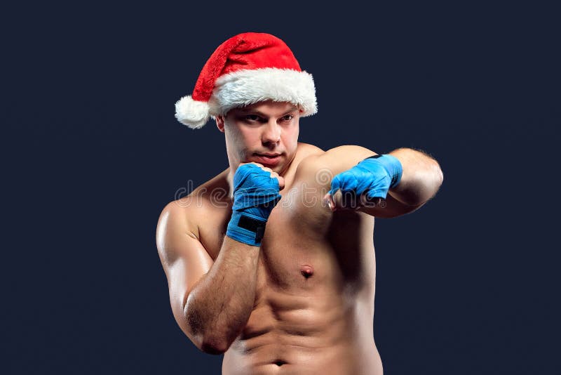 Christmas fitness boxer wearing santa hat boxing royalty free stock images Christmas fitness boxer wearing santa hat boxing royalty free stock images