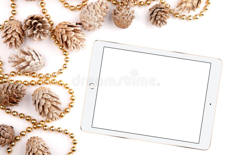Christmas flat lay mockup desktop, pine cones & tablet on a white background royalty free stock image Christmas flat lay mockup desktop, pine cones & tablet on a white background royalty free stock image