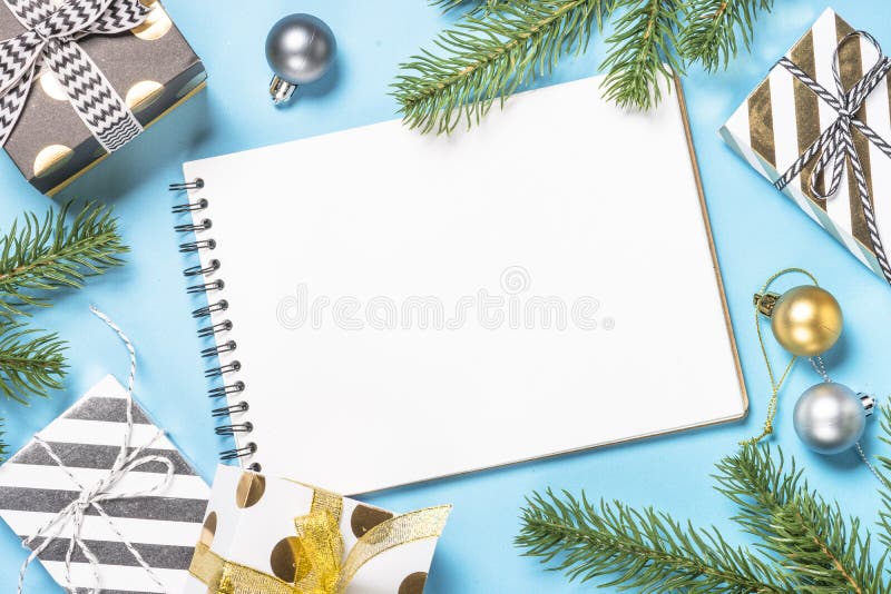 Christmas flatlay background - silver and gold decorations on bl. Christmas flatlay background. Silver and gold christmas decorations and present box on blue stock images Christmas flatlay background - silver and gold decorations on bl. Christmas flatlay background. Silver and gold christmas decorations and present box on blue stock images