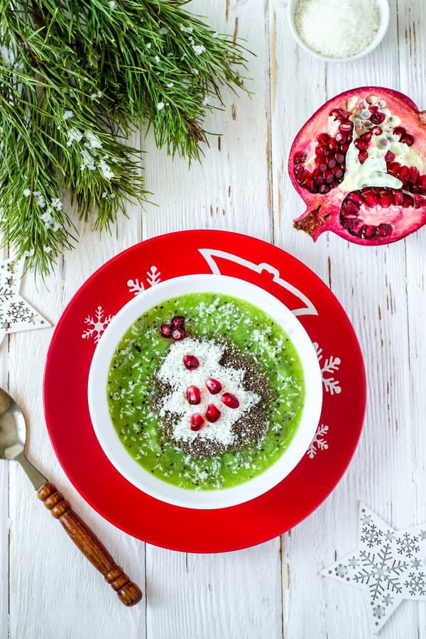 Christmas food healthy idea. Green smoothies decorated with Christmas tree. Natural, copy.