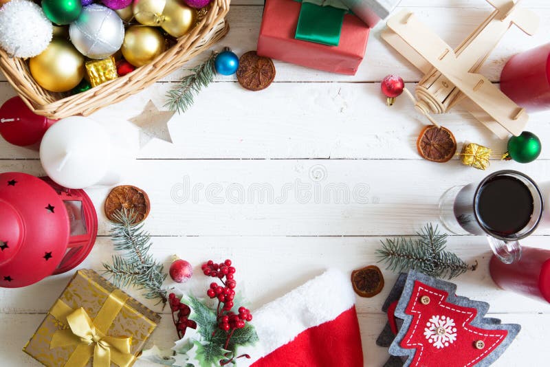 Christmas frame or border with a large assortment of christmas prop, decorations, balls, gifts and candles on a white wooden backg royalty free stock photography Christmas frame or border with a large assortment of christmas prop, decorations, balls, gifts and candles on a white wooden backg royalty free stock photography