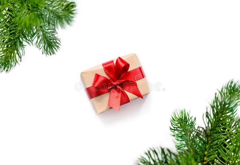 Christmas gift and fir tree branches. Top view