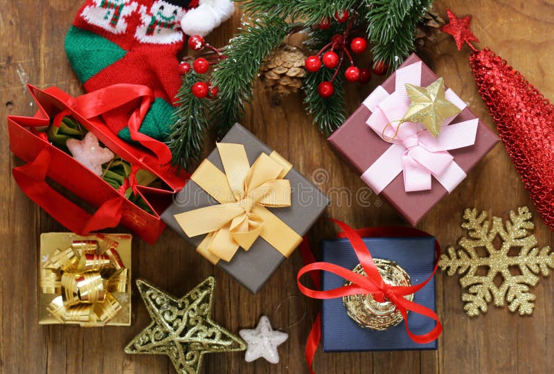 Christmas gifts and decorations on a wooden background