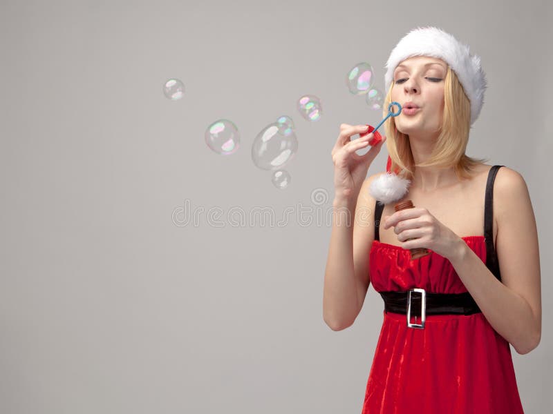 Christmas girl with bubble blower