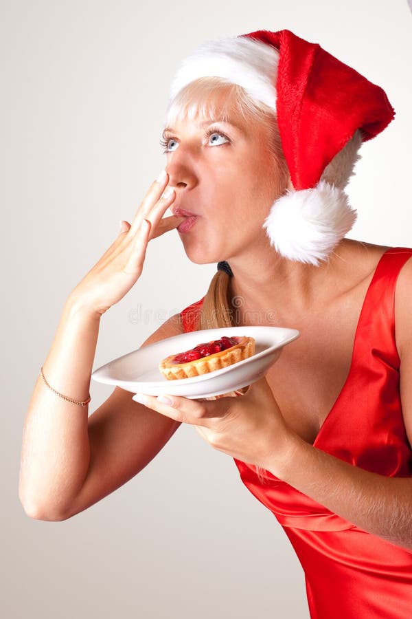 Christmas girl in red posing with cake. 3