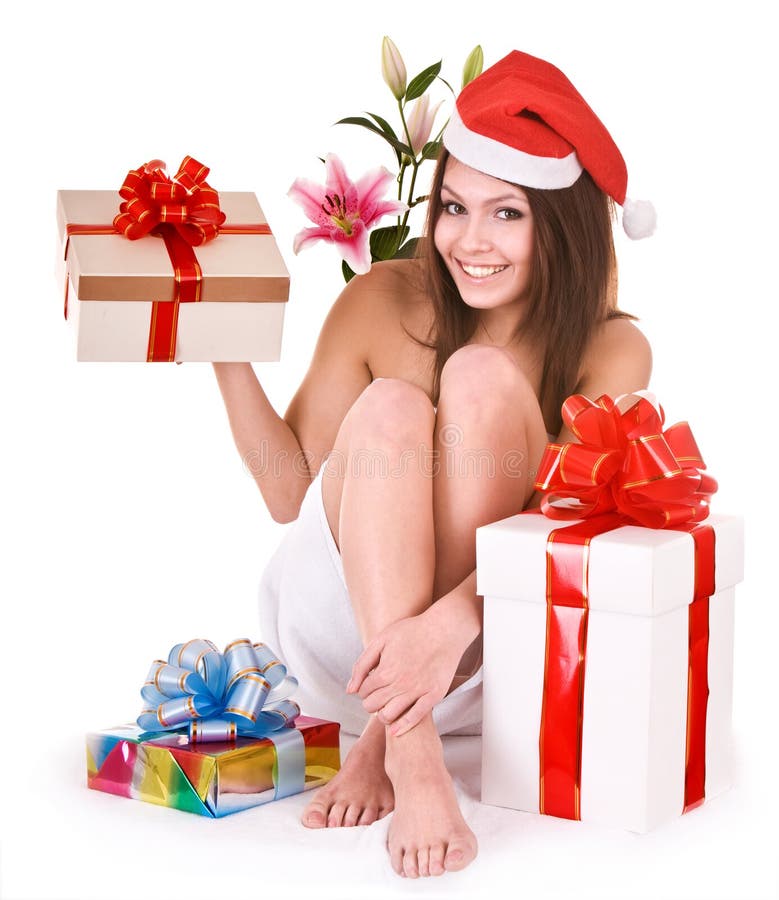 Christmas girl in santa hat, group gift box in spa royalty free stock photography Christmas girl in santa hat, group gift box in spa royalty free stock photography