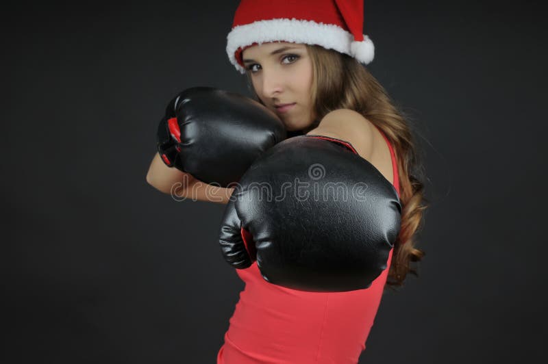 Christmas girl wearing boxing gloves