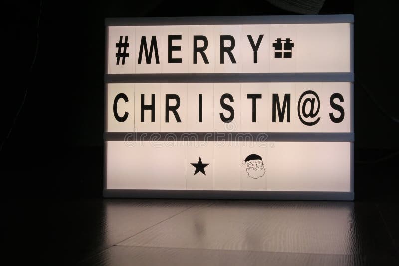 Christmas Greetings Note on a Light Board. Christmas Greetings Stock