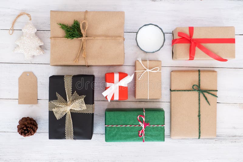Christmas handmade present gift boxes and rustic decoration on white wooden board. royalty free stock photo Christmas handmade present gift boxes and rustic decoration on white wooden board. royalty free stock photo