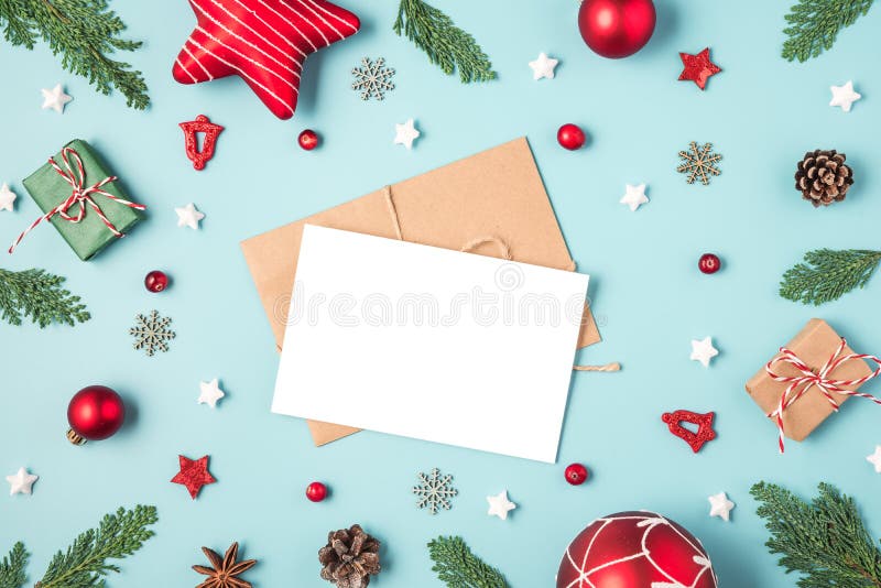 Christmas and Happy New Year greeting card in frame made of fir tree branches, gift boxes, red holiday decorations royalty free stock images Christmas and Happy New Year greeting card in frame made of fir tree branches, gift boxes, red holiday decorations royalty free stock images