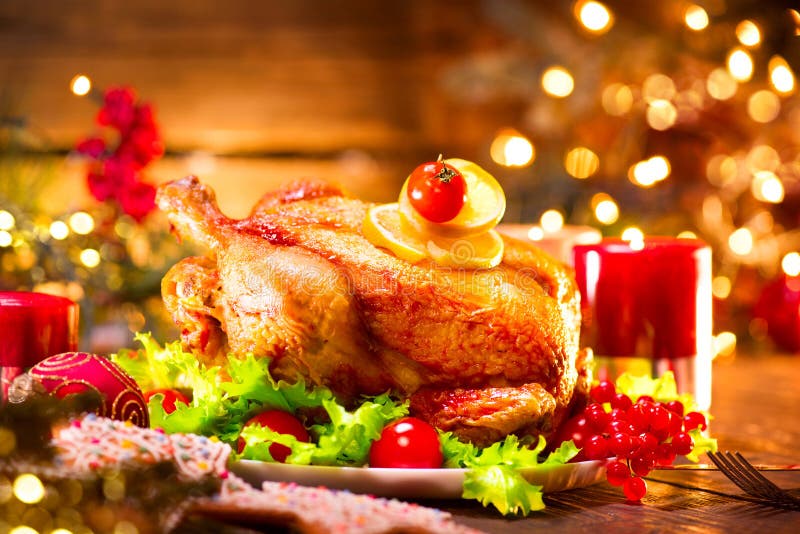 Christmas holiday family dinner. Decorated table with roasted turkey