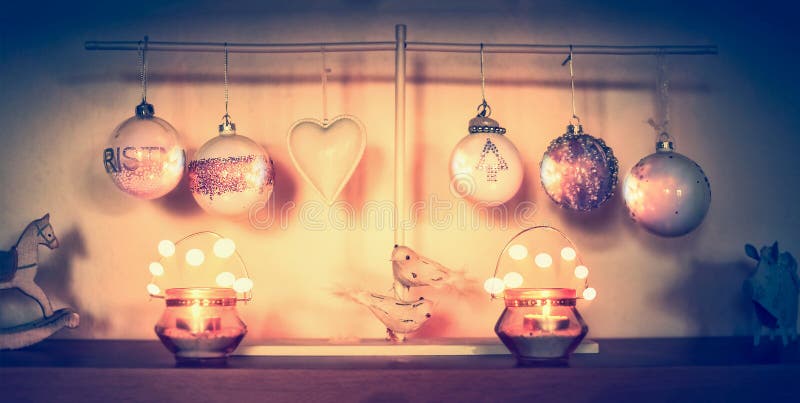 Christmas home decoration on tables with balls, candles and bokeh stock image Christmas home decoration on tables with balls, candles and bokeh stock image